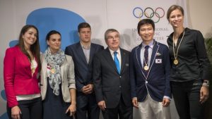 The IOC's President Thomas Bach (centre) poses with newly-elected members of the athletes' commission (from left): Sarah Walker of New Zealand, Yelena Isinbayeva of Russia, Daniel Gyurta of Hungary, Ryu Seung-min of South Korea and Britta Heidemann of Germany.