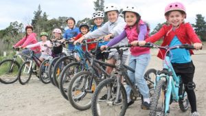 Riley Foote, left, Phebe Simpson-Allan, Esther Kerr, Elijah Kerr, Axell Simpson-Allan, Jacob Kerr, Tyson Foote, Dylen Foote and Sadee Simpson-Allan are excited plans are moving forward to build a BMX track in Blenheim. Photo: SVEN HERSELMAN/FAIRFAX NZ